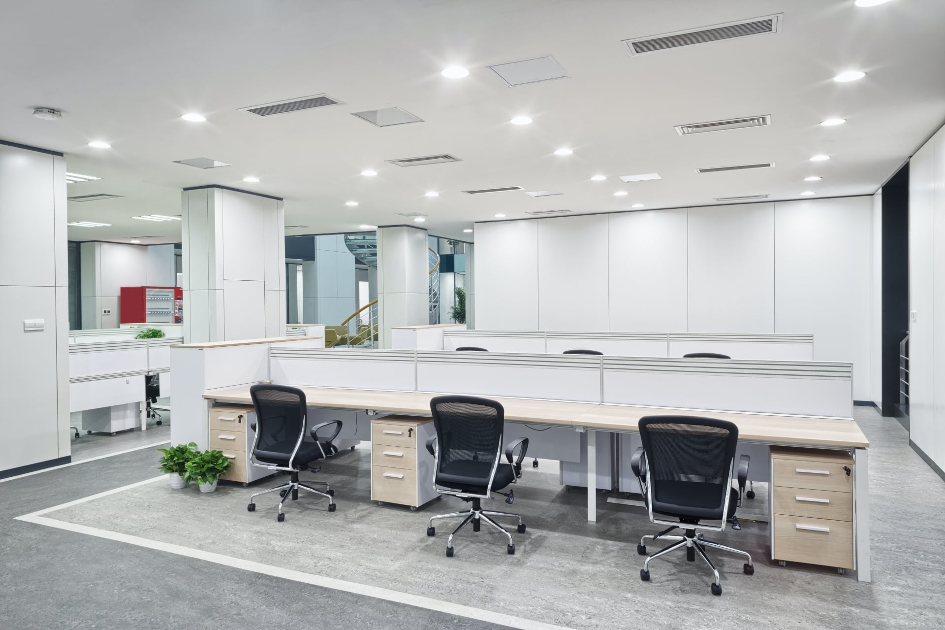 office with low cubicle walls and office chairs