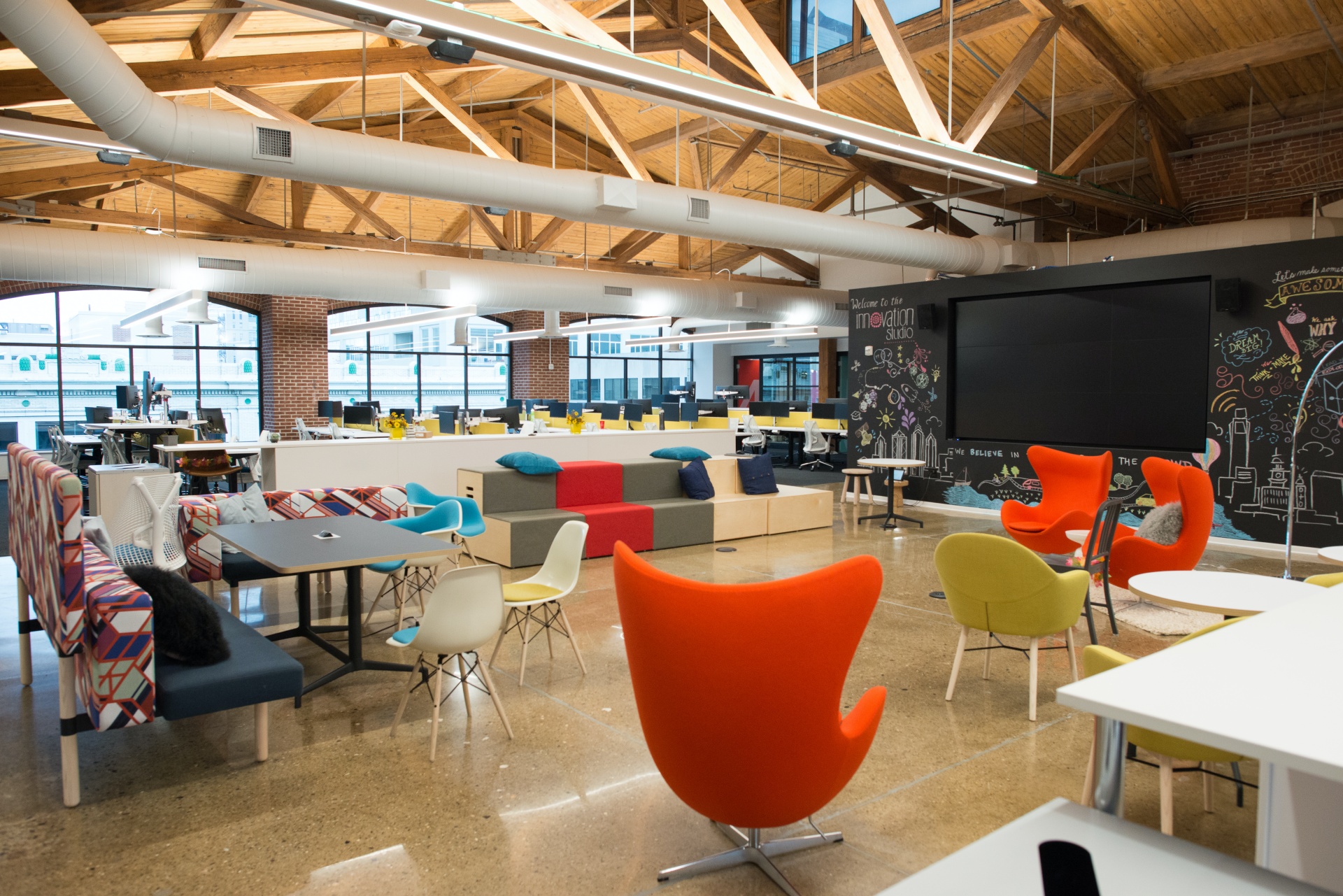 sleek chairs and tables in an open concept office