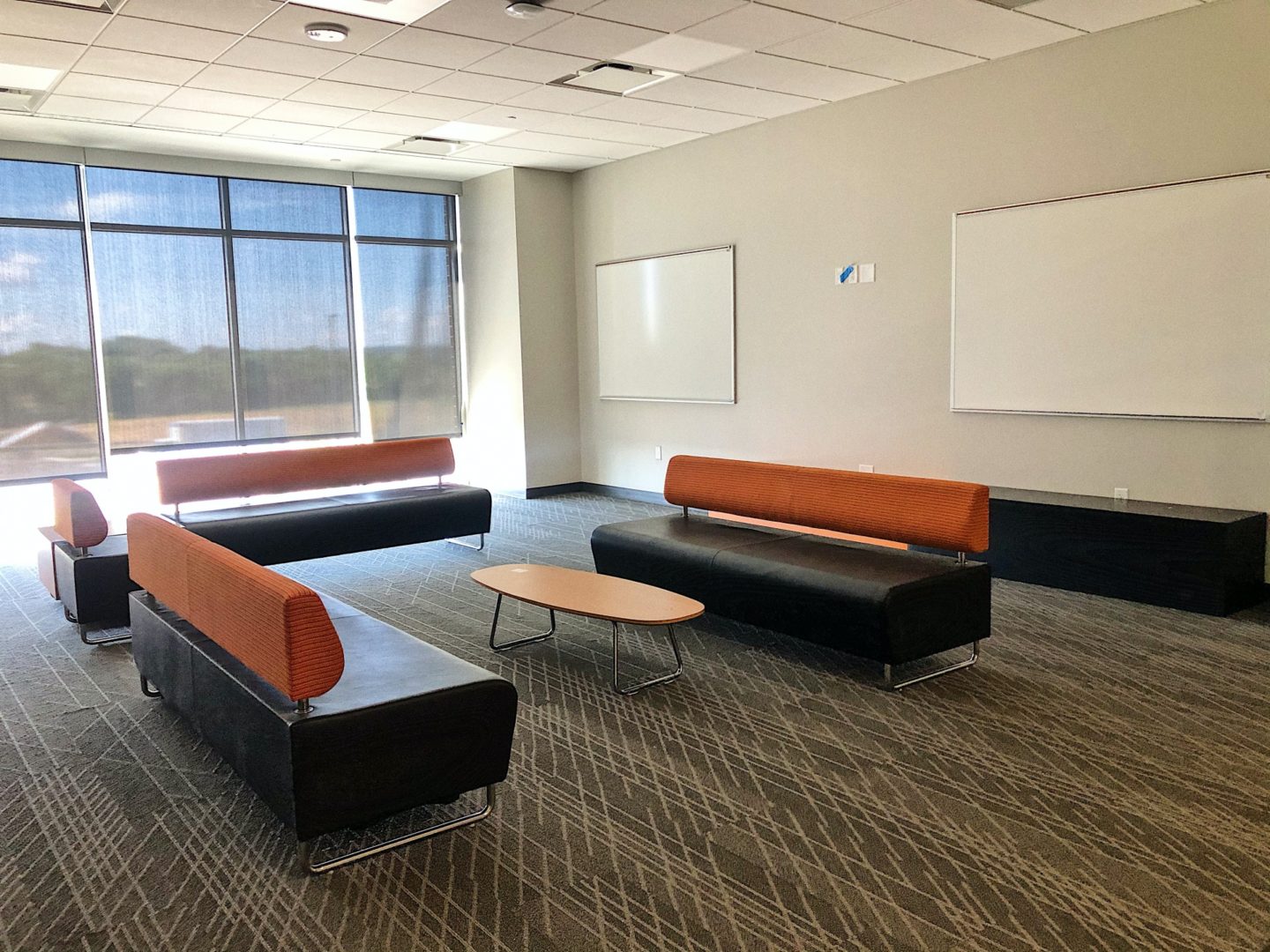 couches and tables in school study area